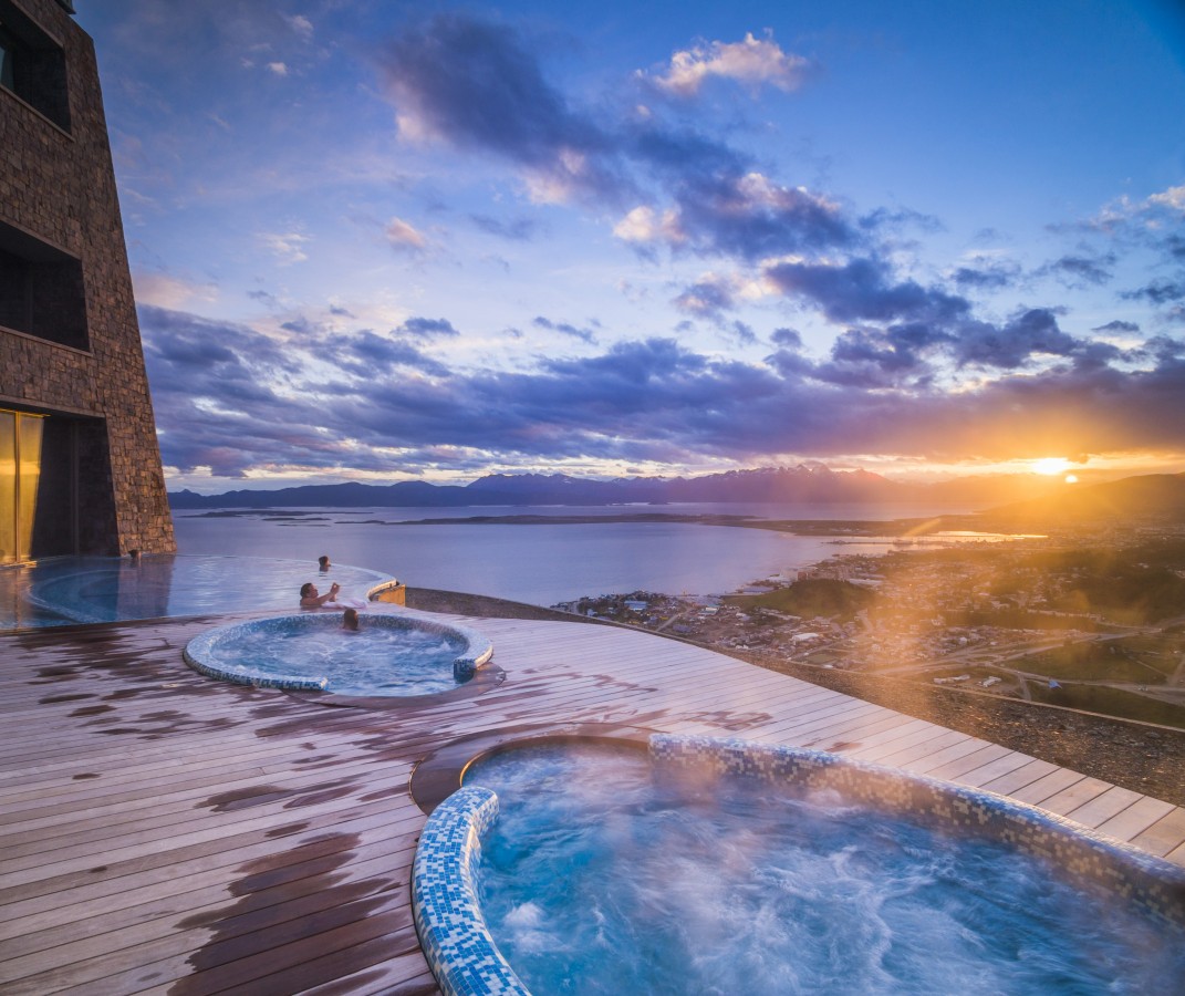 Outdoor swimming pool and jacuzzi at sunset, Hotel Arakur Ushuaia Resort and Spa, Ushuaia, Tierra del Fuego, Patagonia, Argentina