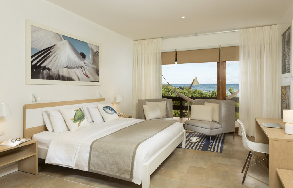 A room at Finch Bay hotel - light neutral palette and sea views