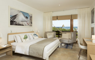 A room at Finch Bay hotel - light neutral palette and sea views
