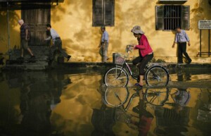 Lady on bike, Hanoi, Vietnam